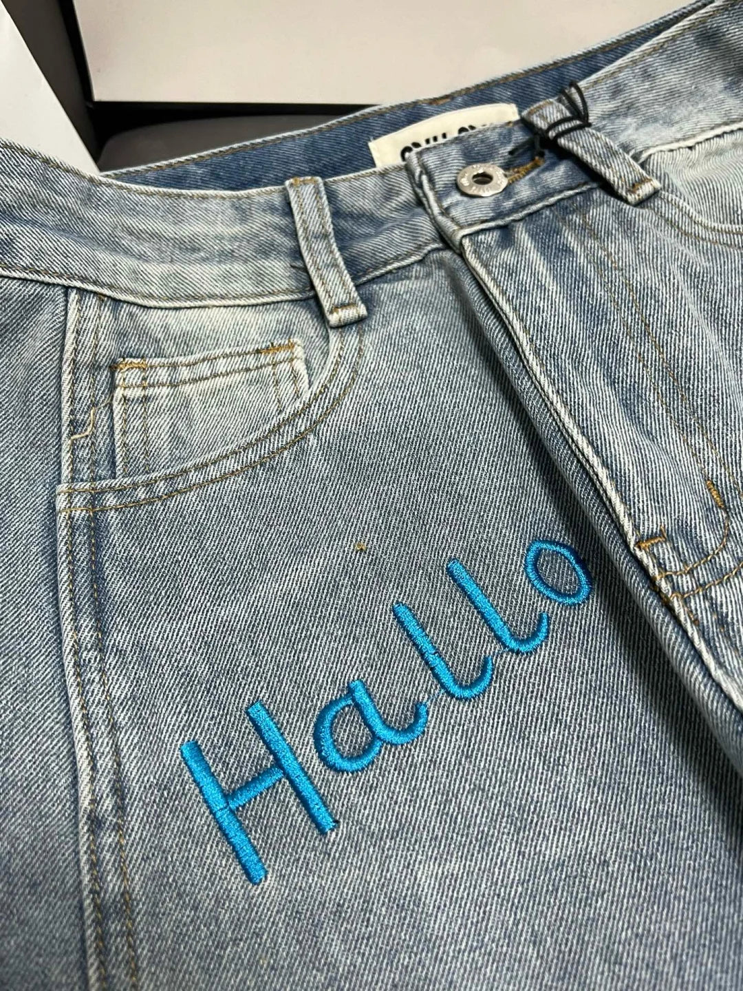 Blue embroidered lettering straight-leg jeans