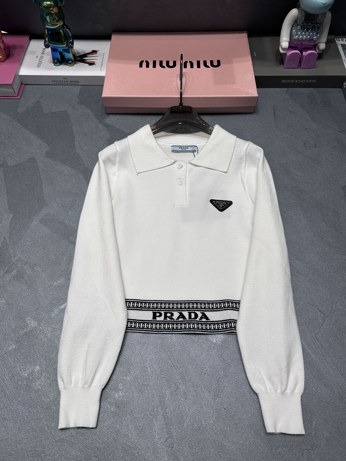 Triangle logo polo collar hem jacquard long-sleeved sweater