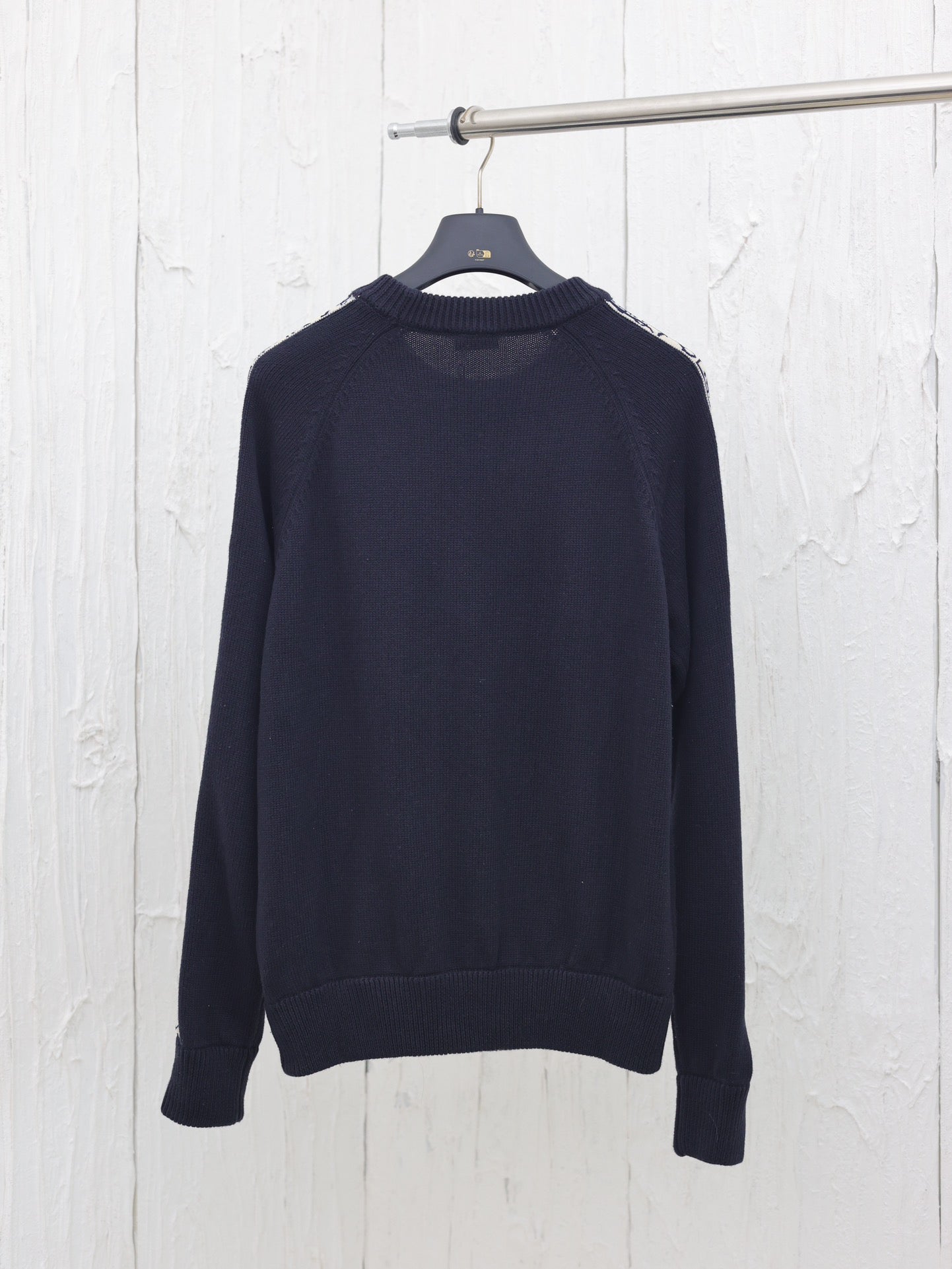 Knitted crew neck sweater with jacquard sleeves